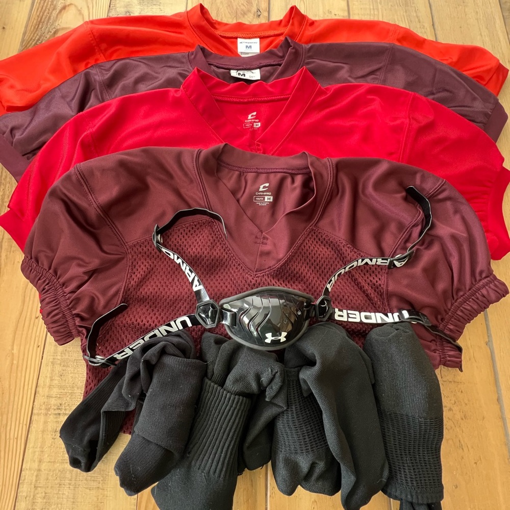 Bundle of practice football gear.  4 practice jerseys, 4 black socks & chinstrap